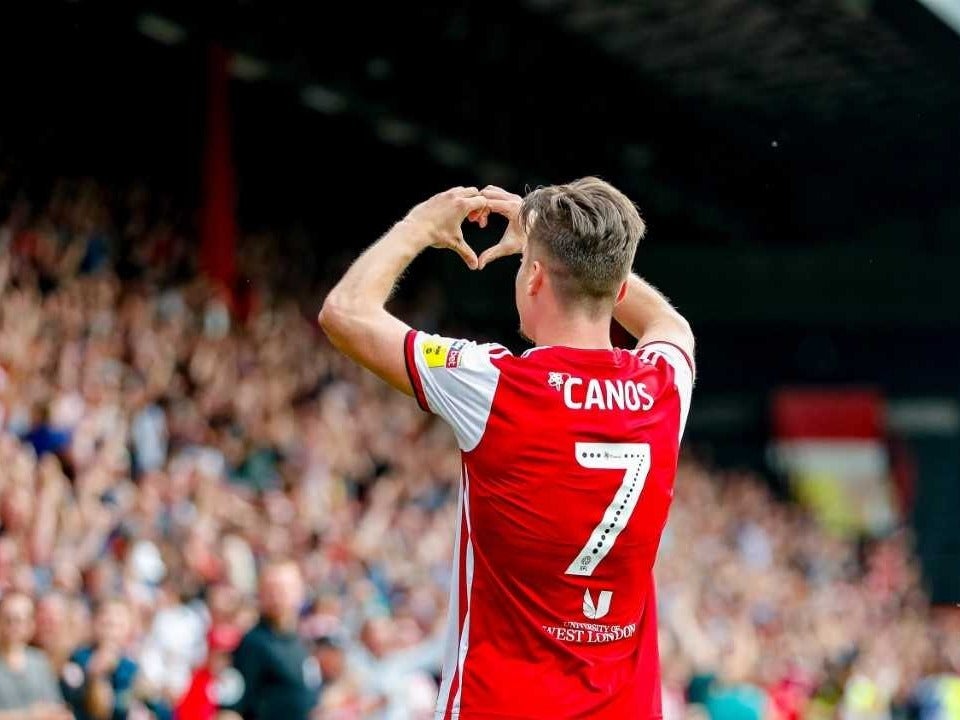 Sergi Canos celebrates in front of Brentford’s supporters