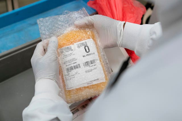 A lab technician freeze packs donated convalescent plasma donated by recovered Covid-19 patients in Dulles, Virginia