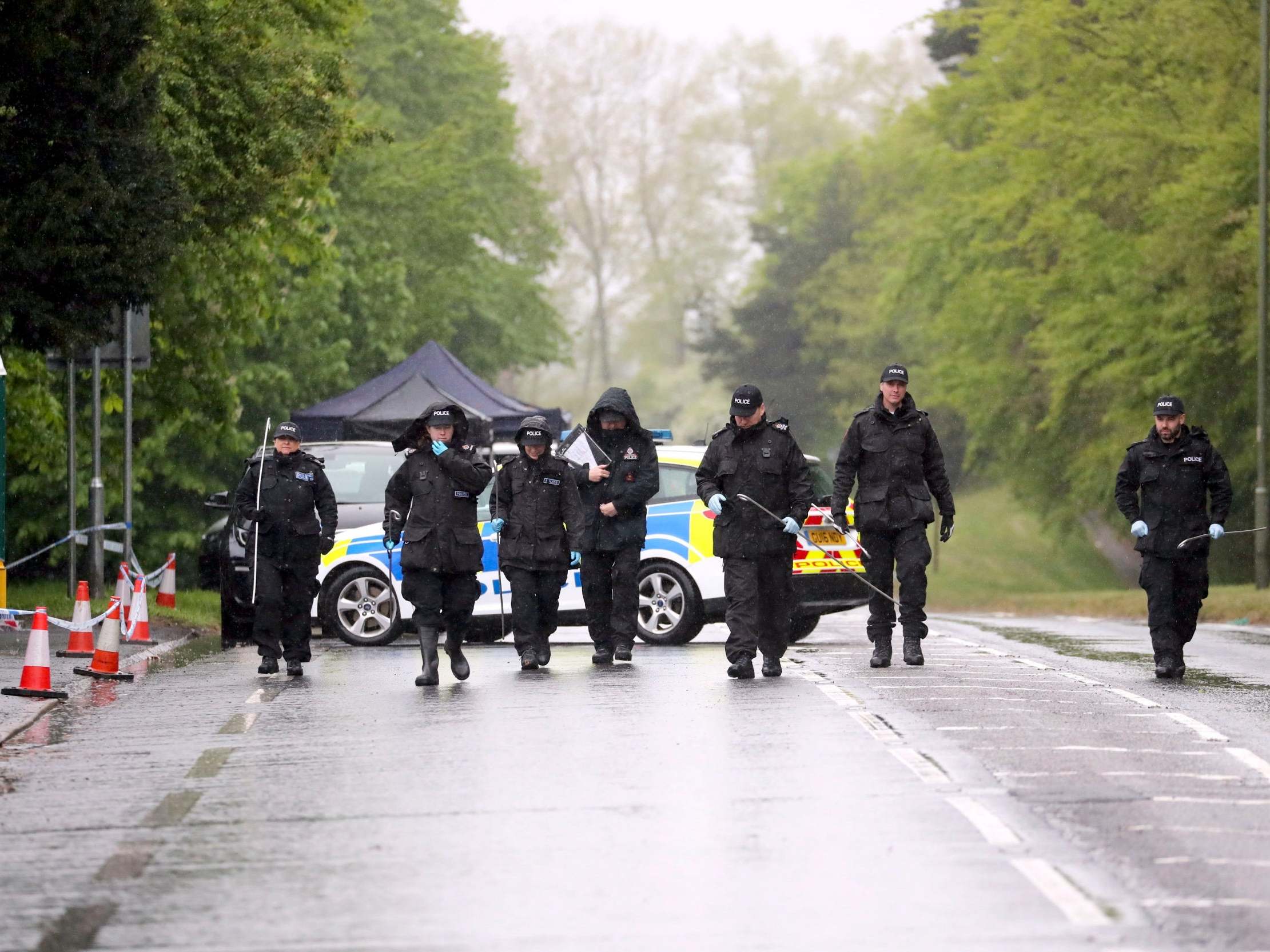 Forensic officers from Surrey Police investigate the suspected murder of an 88-year-old man, named locally as Dennis Kellond, who was found dead at his bungalow in the village of Godstone on 27 April 2020.