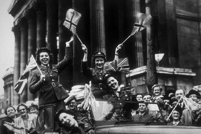 Members of the Auxiliary Territorial Service drive through Trafalgar Square during the celebrations in 1945