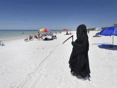 Lawyer dressed as Grim Reaper protests reopening of Florida's beaches