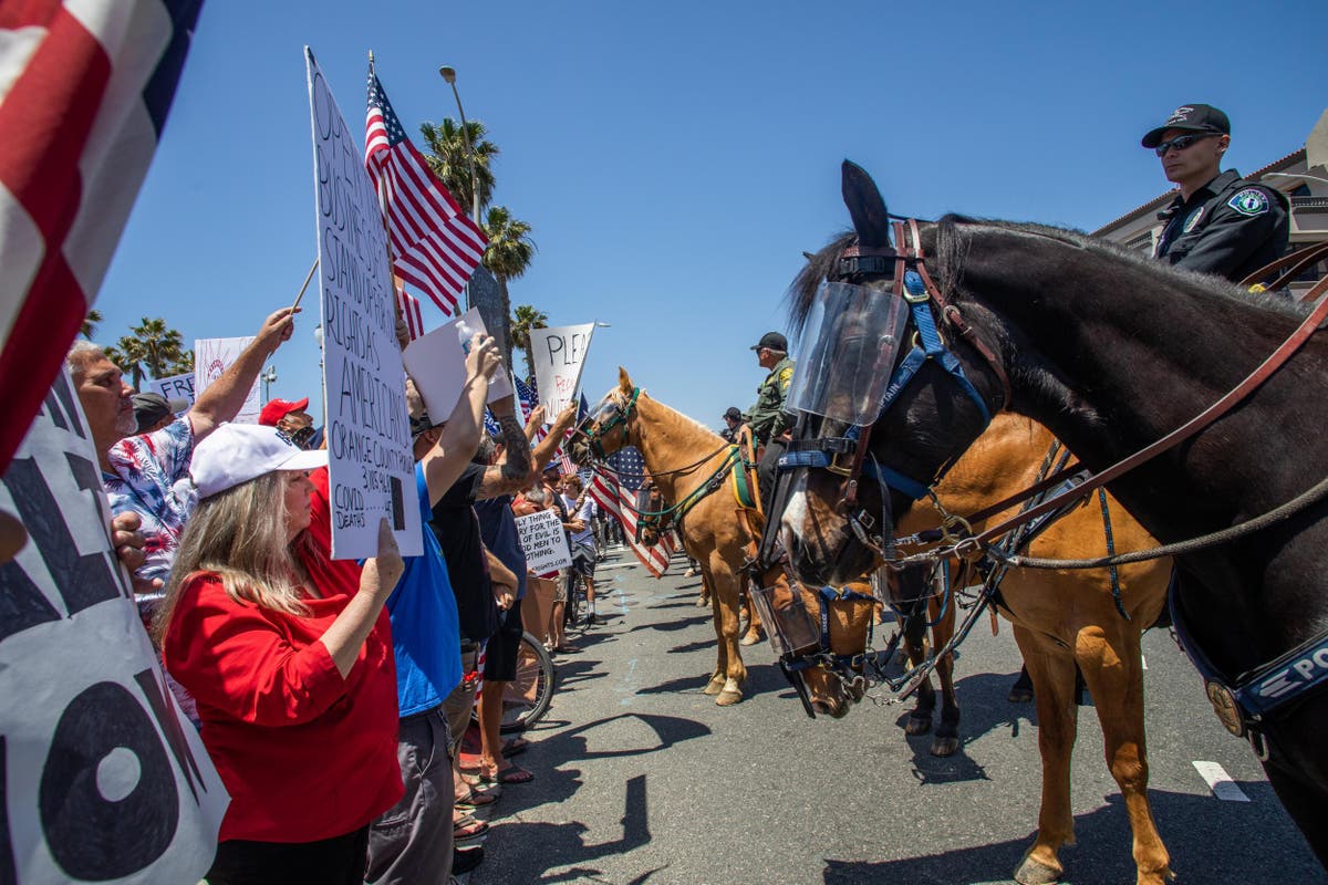 Lockdown protesters flock to California beach in their thousands The