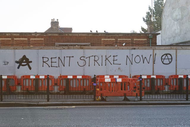 Graffiti reading ‘Rent strike now’ near Turnpike Lane station in London