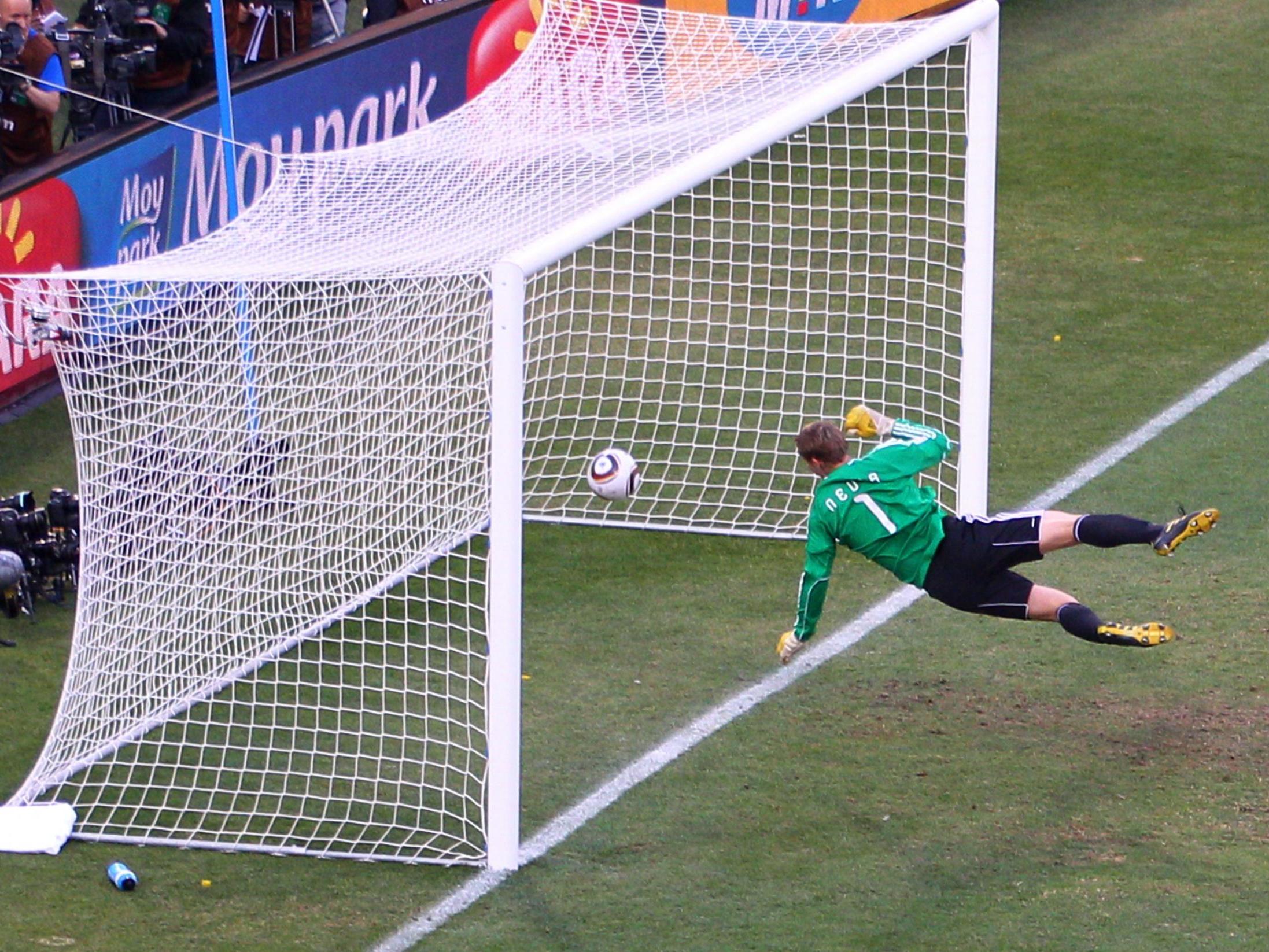 Manuel Neuer watches the ball bounce over the line