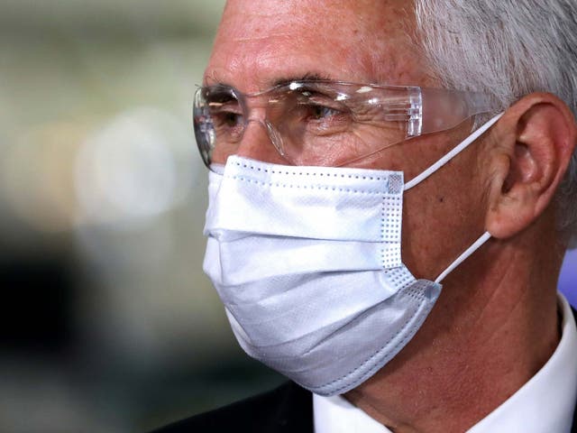 US vice president Mike Pence work a mask on a visit to the General Motors plant in Indiana, after earlier criticism