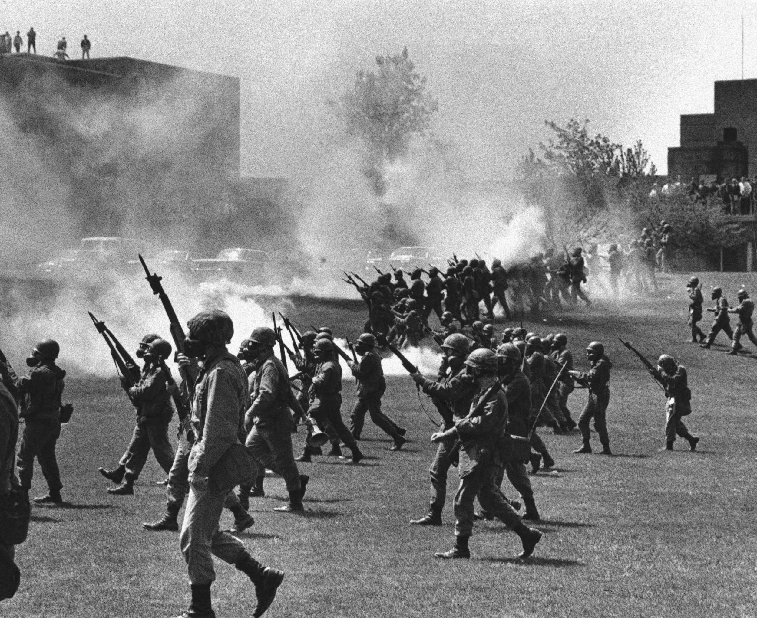 The Ohio National guard move in on anti-war protesters at Kent State University in 1970.