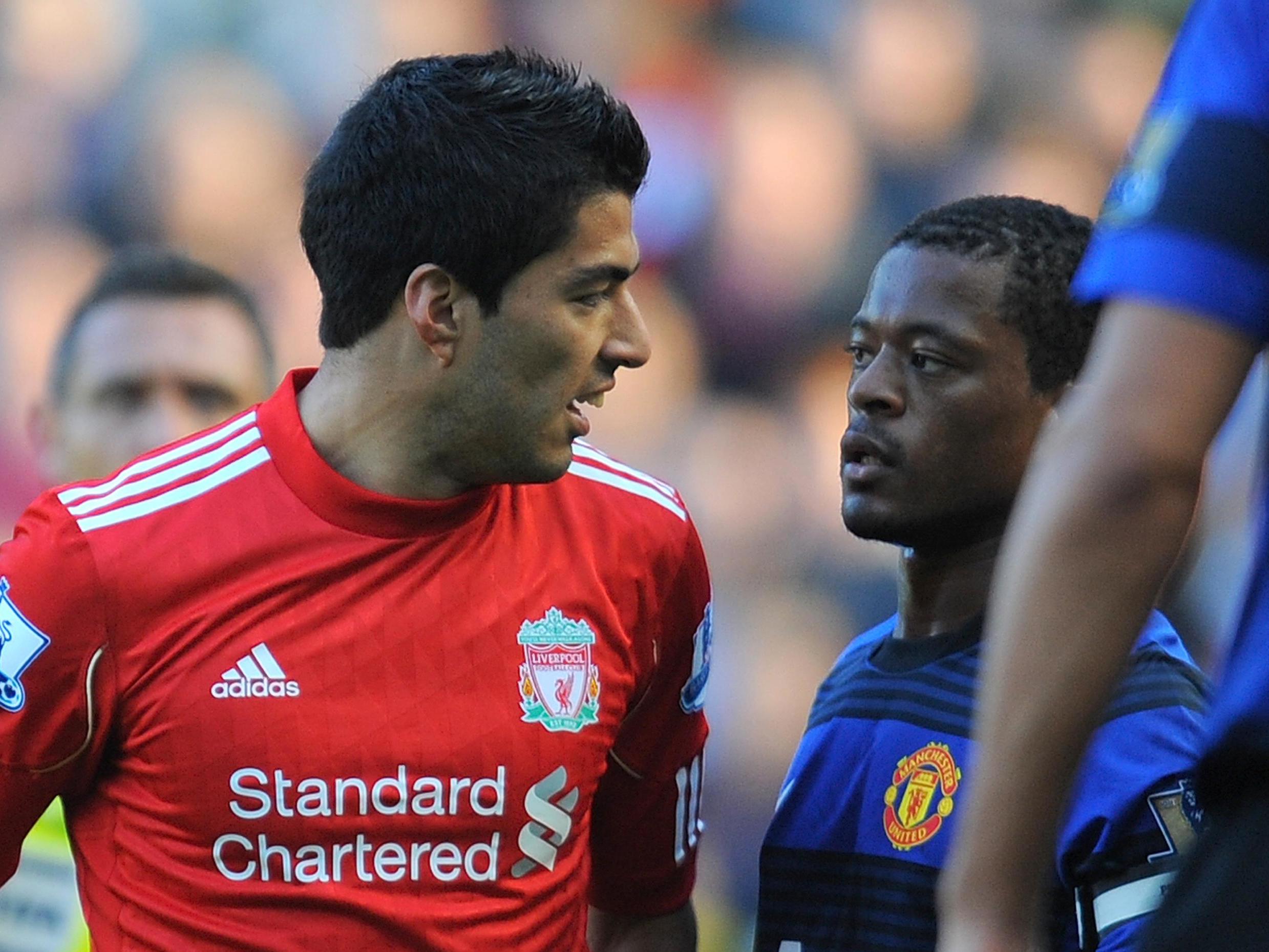 Luis Suarez and Patrice Evra