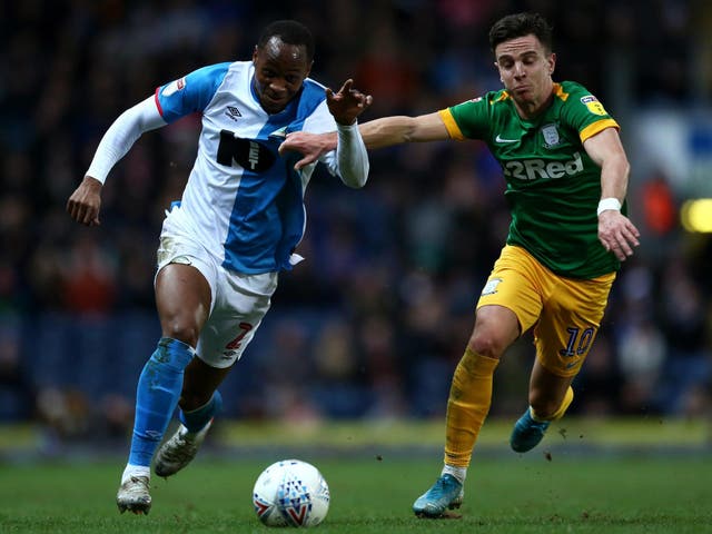 Ryan Nyambe of Blackburn Rovers battles for possession
