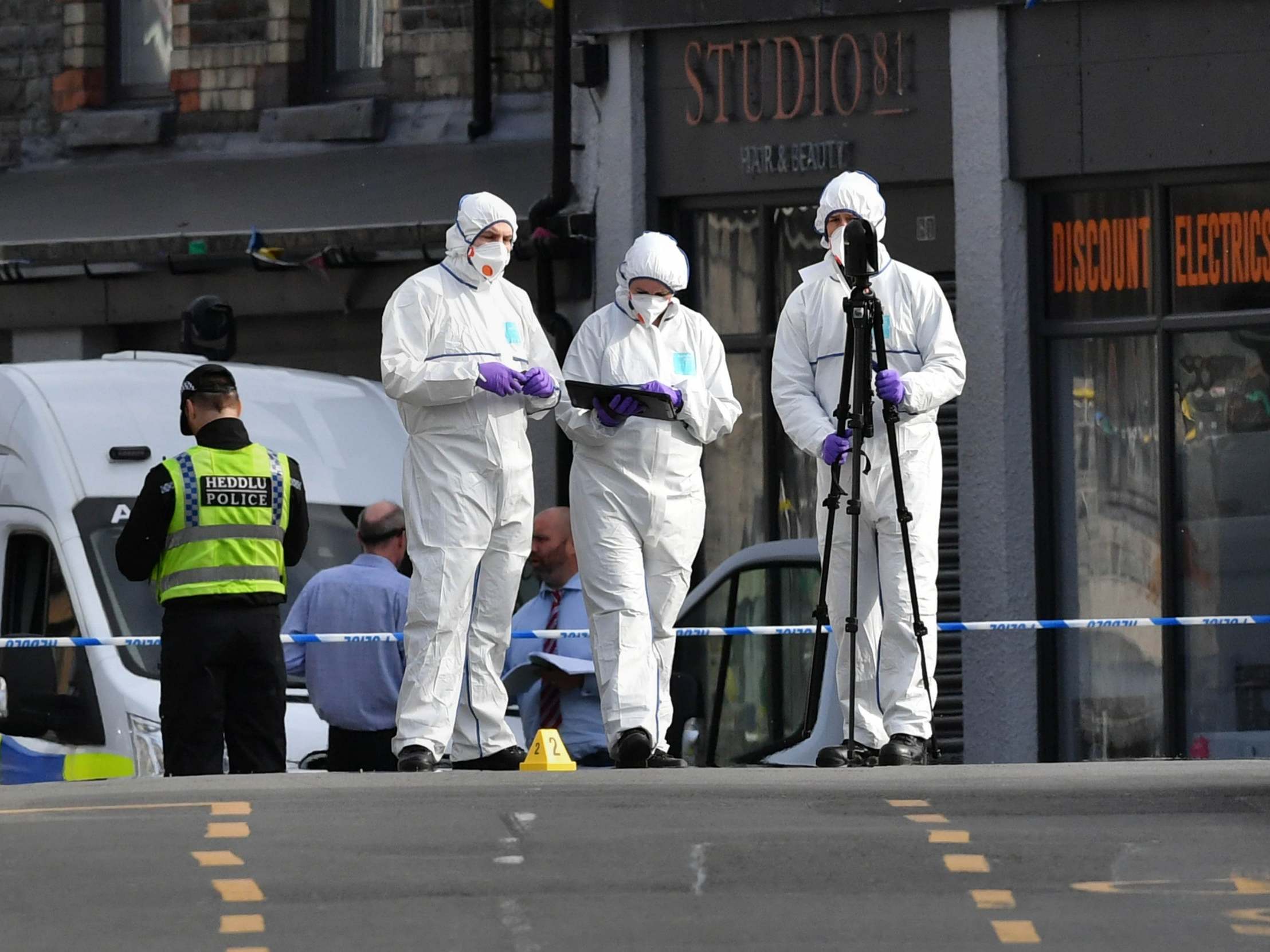 Forensic officers at the scene of a stabbing at a Co-op supermarket in the village of Pen Y Graig, South Wales, 5 May 2020.