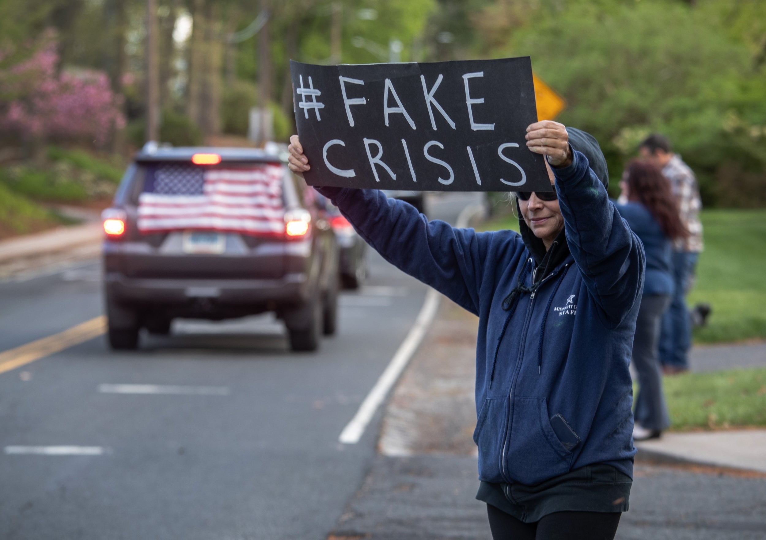 Demonstrators hold a "rolling car rally" in front of Democratic Governor Ned Lamont's residence while protesting the state's stay-at-home order to combat the coronavirus pandemic