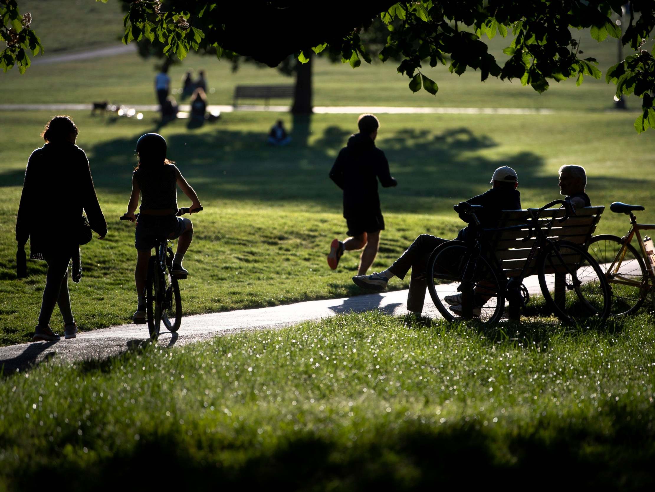 People relax and exercise in Primrose Hill park in central London, as the UK continues in lockdown to help curb the spread of the coronavirus, 6 May 2020.