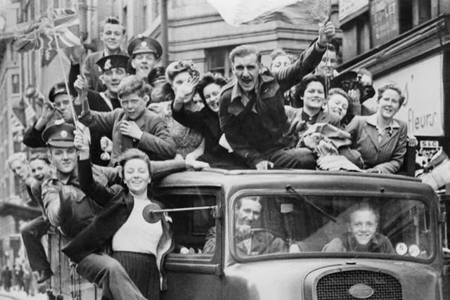 A truck of revellers passing through the Strand in London following the announcement of Germany's surrender and the end of hostilities in Europe, 8 May 1945.