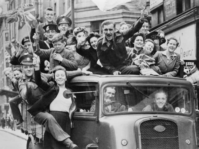 A truck of revellers passing through the Strand in London following the announcement of Germany's surrender and the end of hostilities in Europe, 8 May 1945.