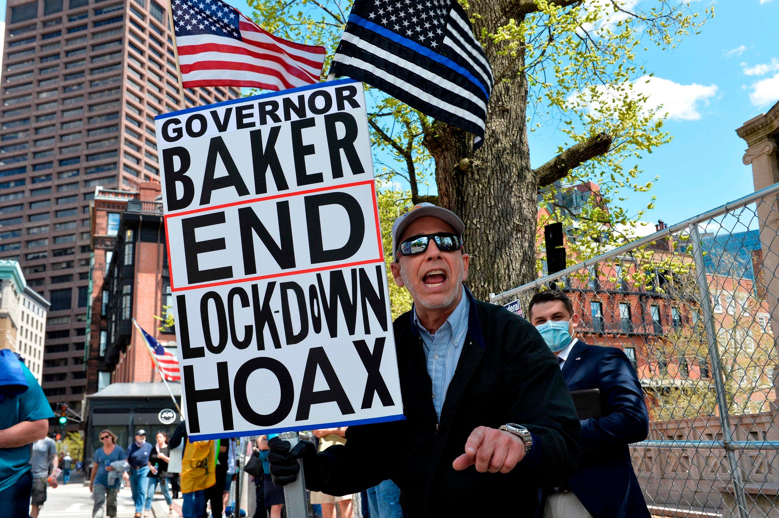 Protesters rally outside the Massachusetts State House in Boston on Monday