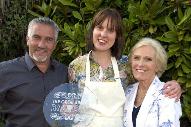 Frances Quinn holds her Bake Off trophy in 2013, alongside Paul Hollywood and Mary Berry
