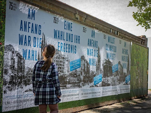 Posters marking the end of World War Two have been put up across Berline
