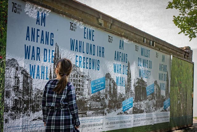 Posters marking the end of World War Two have been put up across Berline