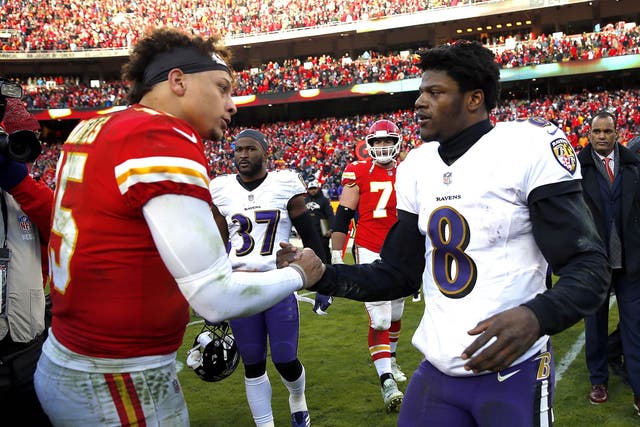 Patrick Mahomes of the Kansas City Chiefs shakes hands with Lamar Jackson of the Baltimore Ravens