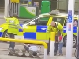 Footage of an incident shows a man being tasered in front of his child at a Manchester petrol station