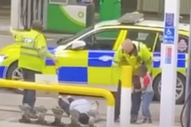 Footage of an incident shows a man being tasered in front of his child at a Manchester petrol station