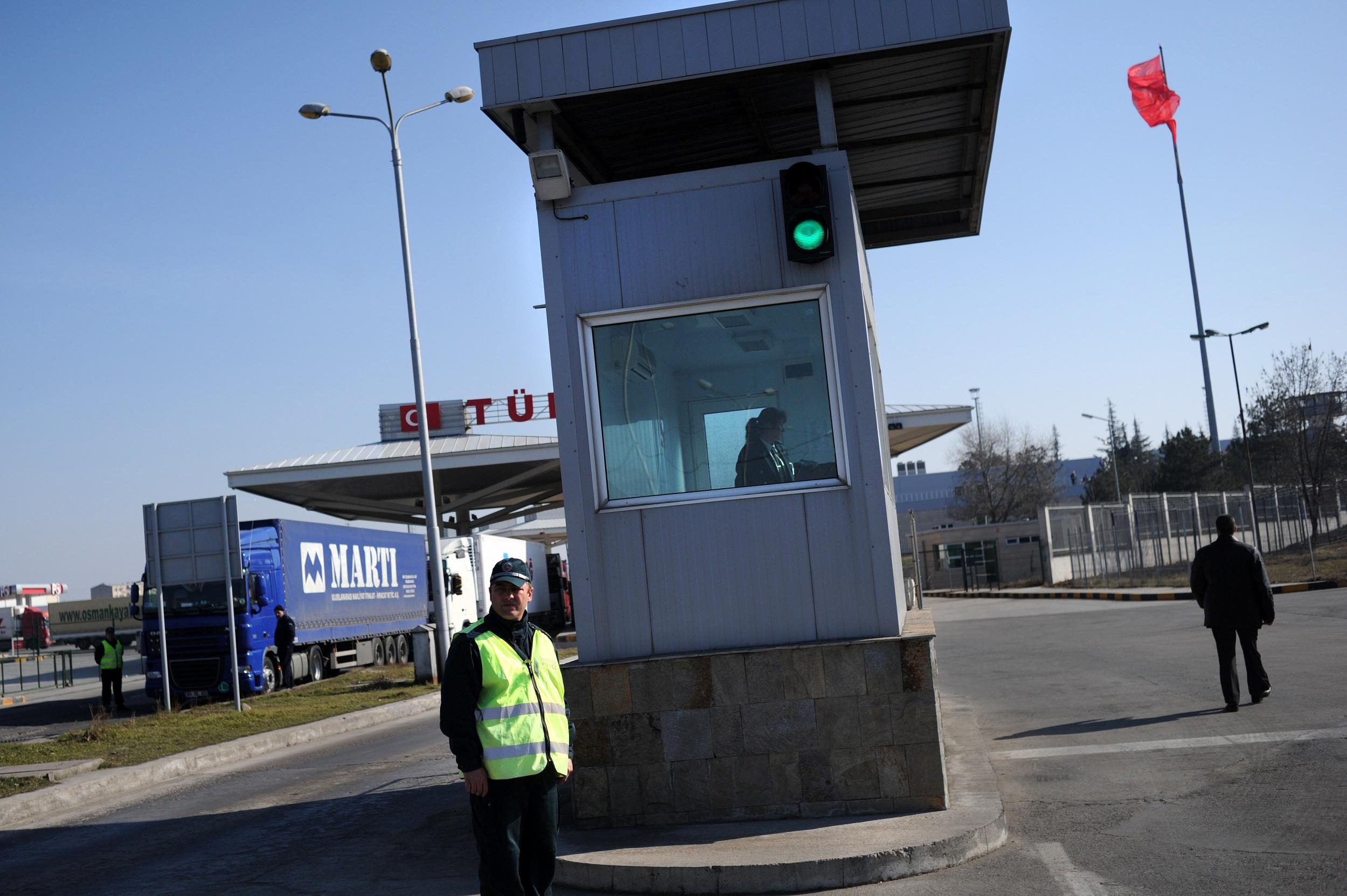 A Bulgarian border policeman stands in front of a border checkpoint at the Kapitan Andreevo border crossing point between Bulgaria and Turkey