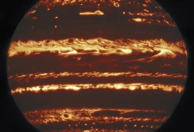 This image showing the entire disk of Jupiter in infrared light was compiled from a mosaic of nine separate pointings observed by the international Gemini Observatory