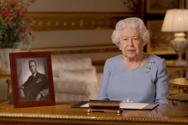 The Queen sat next to a portrait of her father as she made her speech