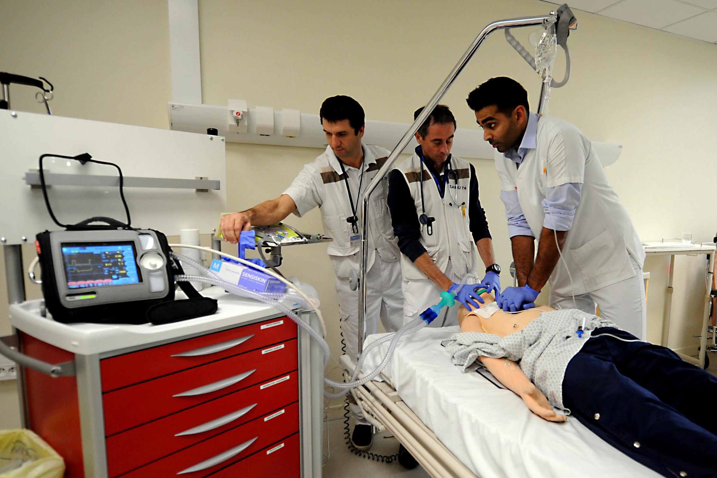 Doctors demonstrate a synchronised ventilation device at a hospital in France