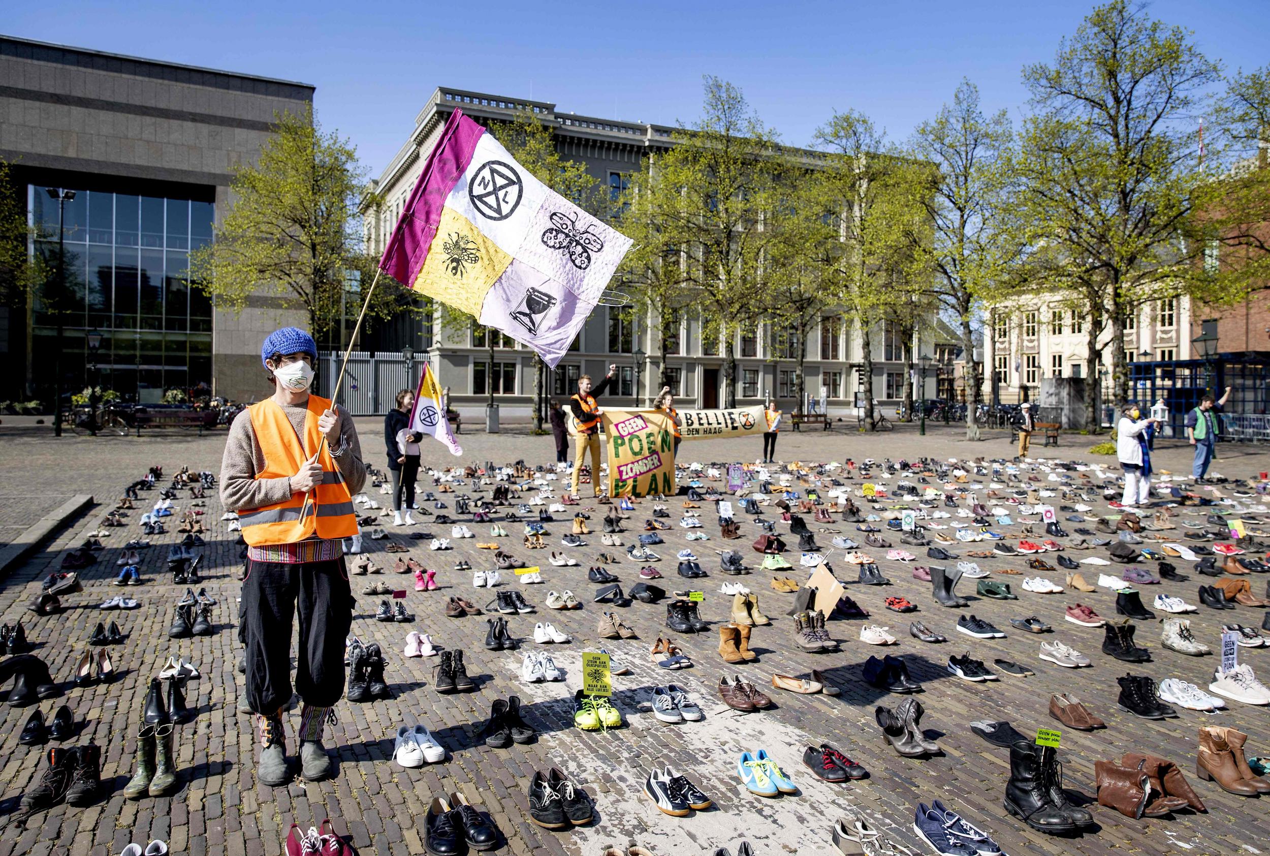 XR members and a collection of shoes belonging to activists who cannot demonstrate due to lockdown in The Hague last month