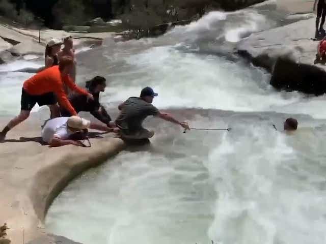 Video released by California authorities shows the moment the hiker was saved from the whirlpool