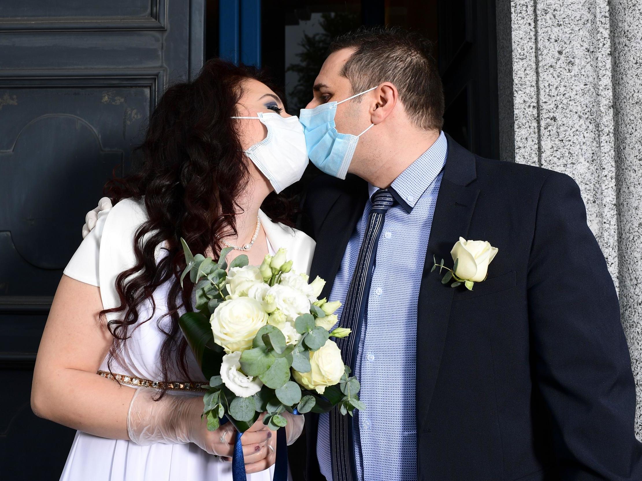 Ester Concilio and Rafaele Carbonelli kiss following their wedding ceremony in Briosco, Italy, this week