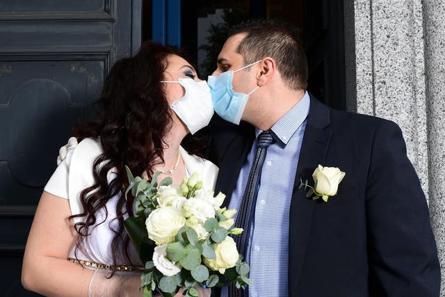 Ester Concilio and Rafaele Carbonelli kiss following their wedding ceremony in Briosco, Italy, this week