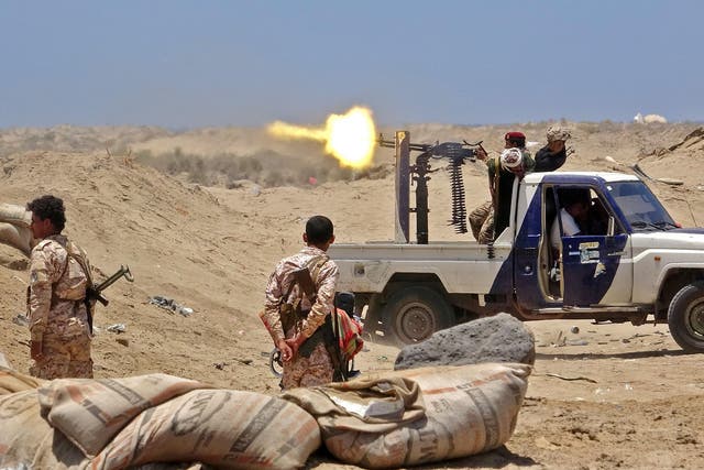 Fighters from the Southern Transitional Council fire towards the positions of Saudi-backed government forces in Abyan 