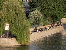 Police ban alcohol along Seine and forced to clear huge crowds