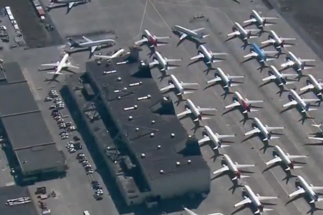 Dozens of aircraft parked at an airport as airlines suspend routes and passenger numbers plummet due to the coronavirus pandemic