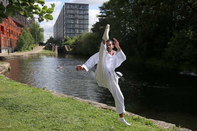 <p>Team GB’s karate athlete Jordan Thomas trains outside his apartment in Manchester</p>