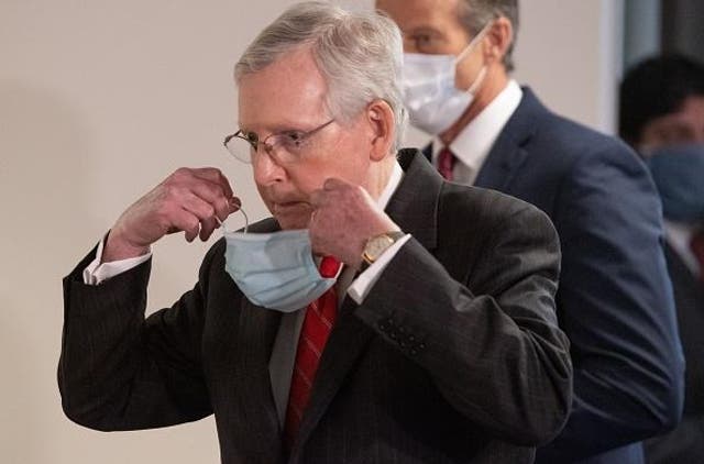 Senate Majority Leader Mitch McConnell dons a mask amid the coronavirus outbreak. AFP via Getty Images