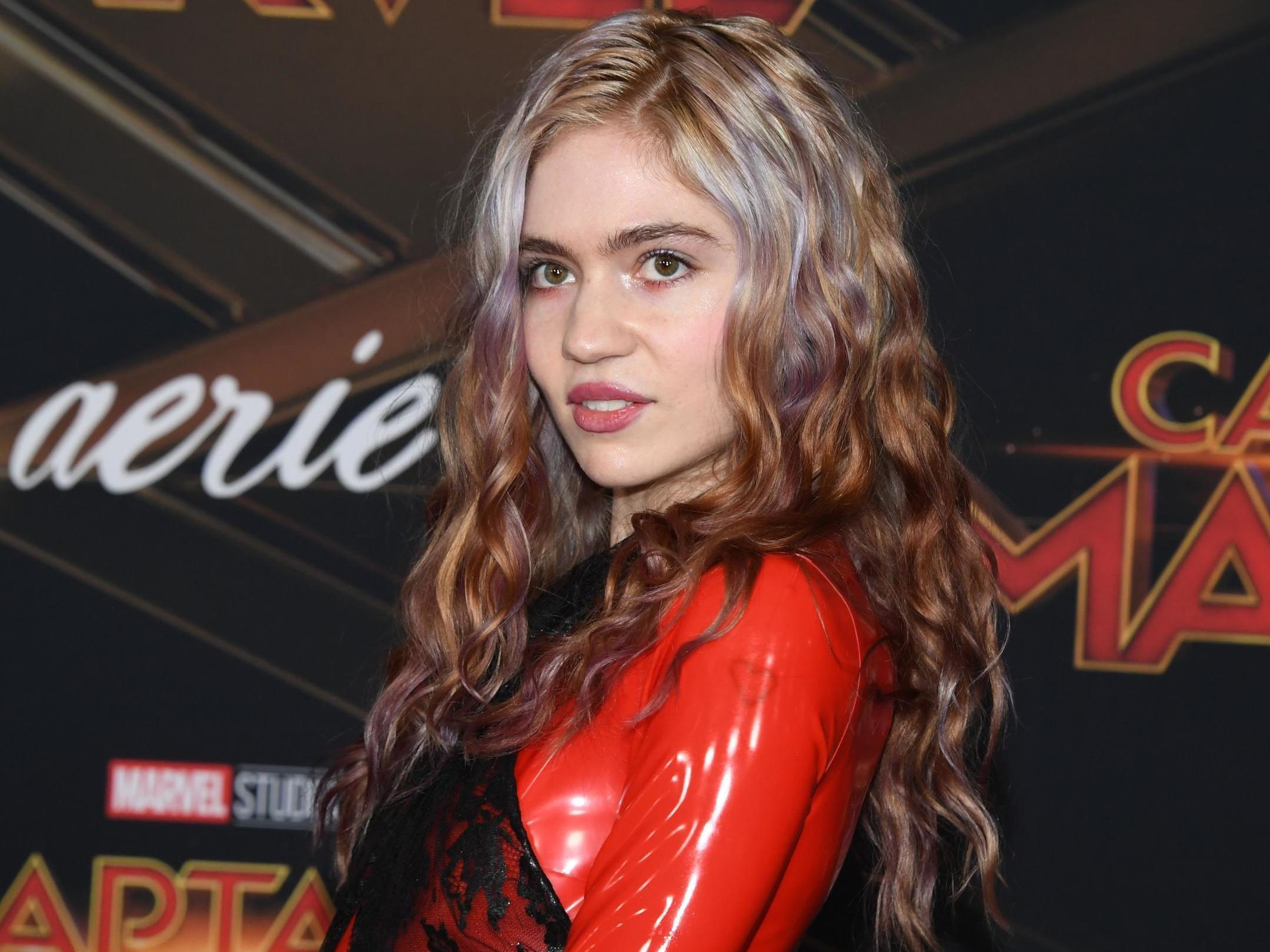 Grimes shares new videos cradling baby X Æ A-12
