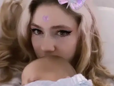 Grimes shares new videos cradling baby X Æ A-12