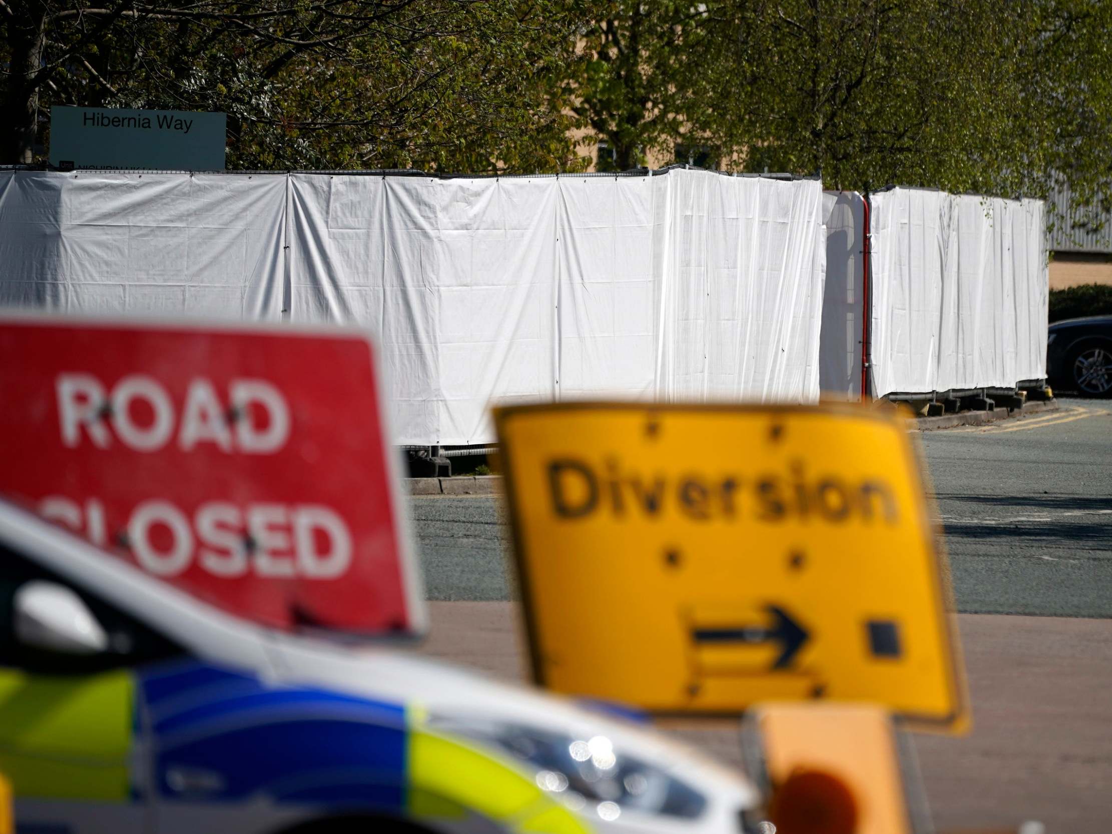 Police have guarded over makeshift morgue at an industrial unit in Trafford Park