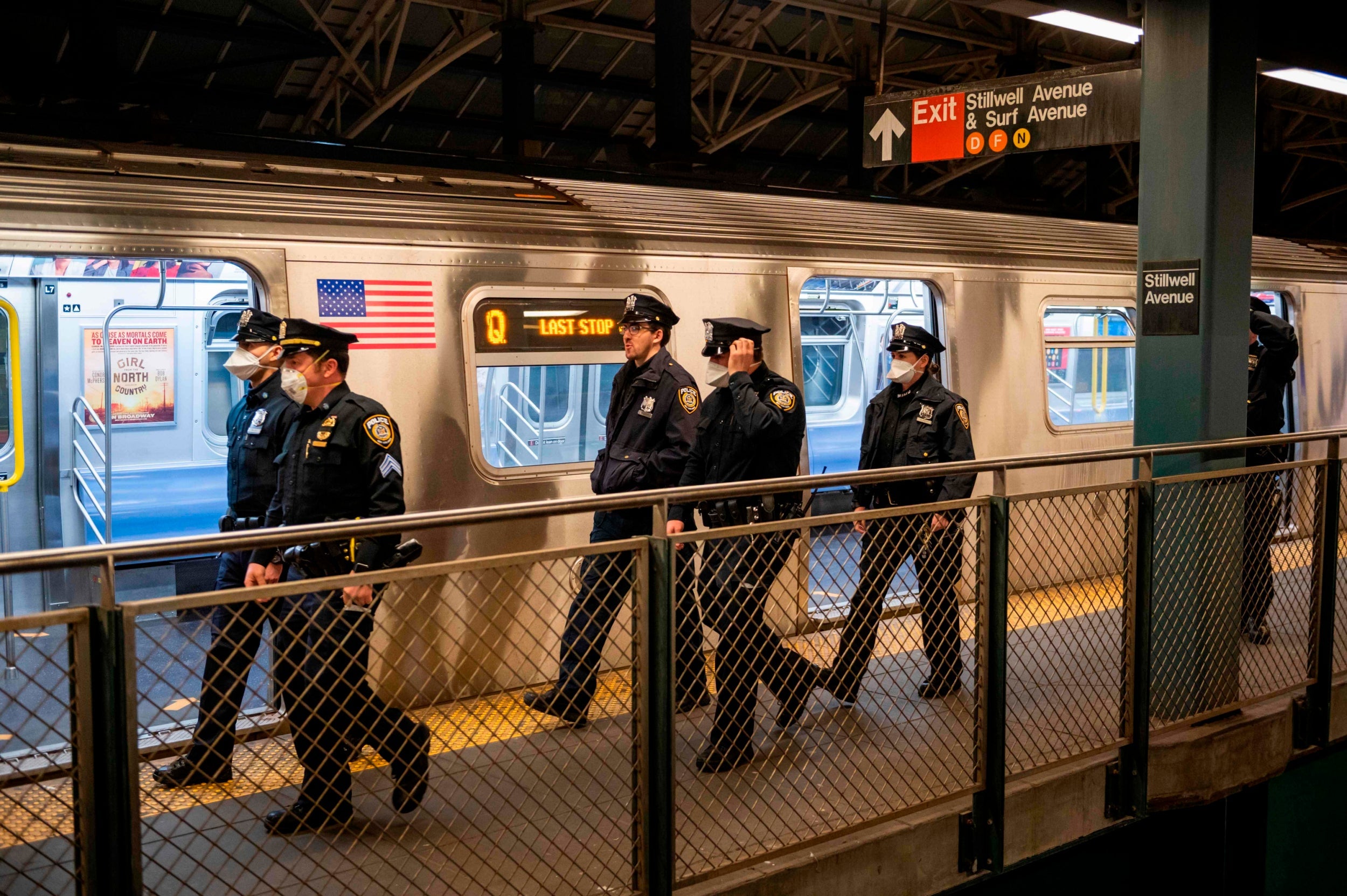 Metopolitan Transportation Authority Police walk the subway platform at the Coney Island station in Brooklyn, New York