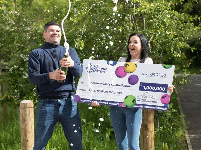 Anthony Canty, 33, from Maldon, in Essex, who has won £1 million in the Euromillions UK Millionaire Maker draw celebrating with his partner Katie Sullivan, 14 May 2020.