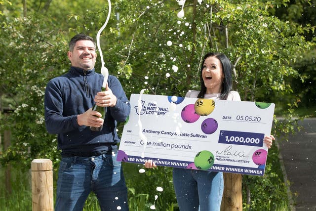 Anthony Canty, 33, from Maldon, in Essex, who has won £1 million in the Euromillions UK Millionaire Maker draw celebrating with his partner Katie Sullivan, 14 May 2020.