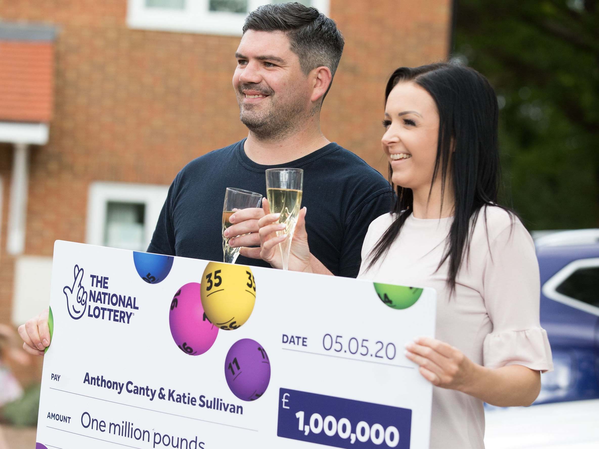 Anthony Canty, 33, from Maldon in Essex, who won £1 million in the Euromillions UK Millionaire Maker draw, celebrating with his partner Katie Sullivan, 14 May 2020.