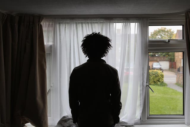 Asylum seeker, Merhawi, from Eritrea, stands inside his single room accommodation in Longford, England 2015