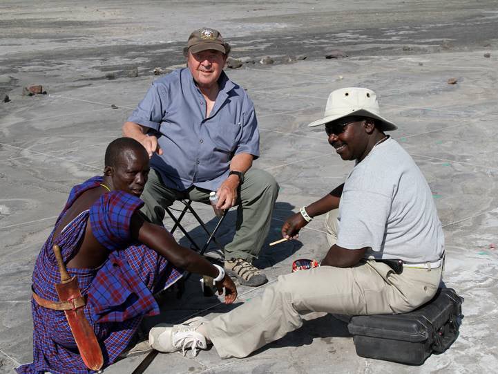 Jim Brett, centre, the American environmentalist who first alerted scientists to the existence of the site with Tanzanian antiquities representative Godfrey Olle Moita, right