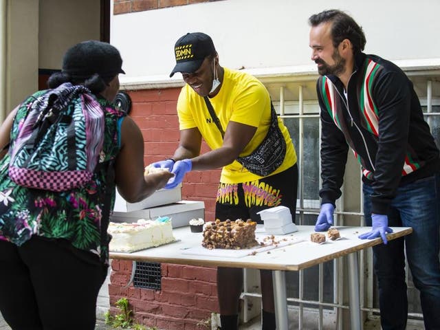 Evgeny Lebedev, proprieter of the Evening Standard and The Independent, joined by rapper KSI to help hand out food to vulnerable people at the St Cuthbert’s Centre in Earl’s Court London