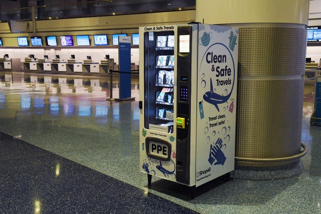 LAS VEGAS, NEVADA - MAY 14: A personal protective equipment vending machine is set up in the Terminal 1 ticketing area at McCarran International Airport on May 14, 2020 in Las Vegas, Nevada. The airport used its social media platforms on Thursday to report that it was the first to install the machines that sell items such as masks, gloves and hand sanitizer. The nation's 10th busiest airport recorded a 53% decrease in arriving and departing passengers for March compared to the same month in 2019, a drop of more than 2.3 million travelers, as the COVID-19 pandemic impacts the travel industry.