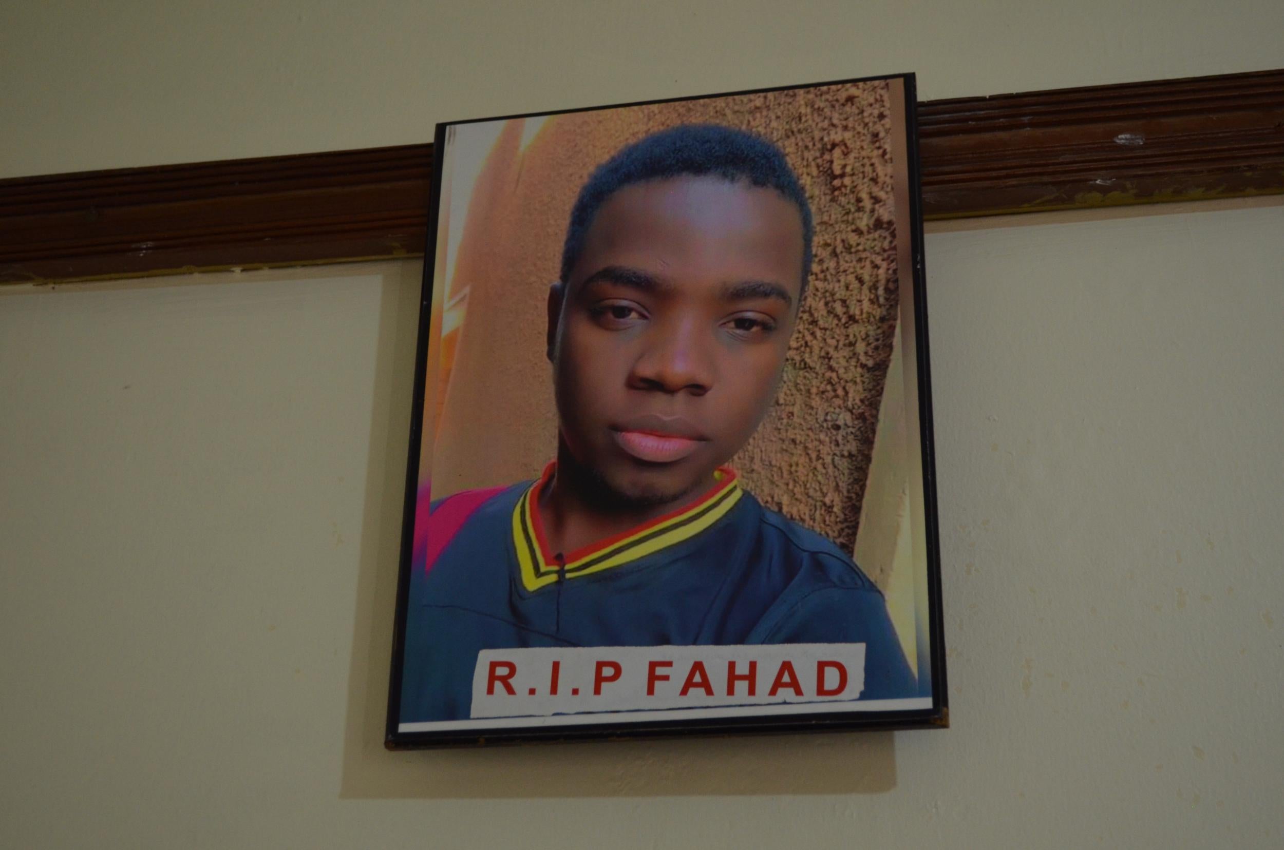 A photo of Fahad Ssemugooma Kawere hangs inside Let’s Walk Uganda’s new shelter (Portia Crowe/The Independent)