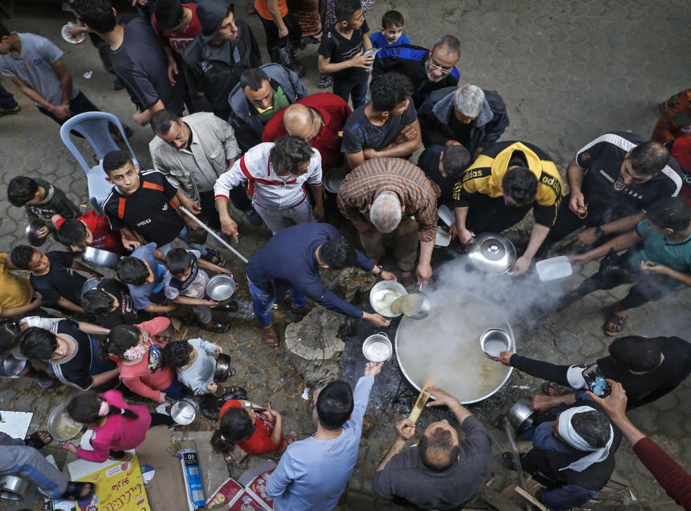 A man prepares soup for the hungry in Gaza during the pandemic